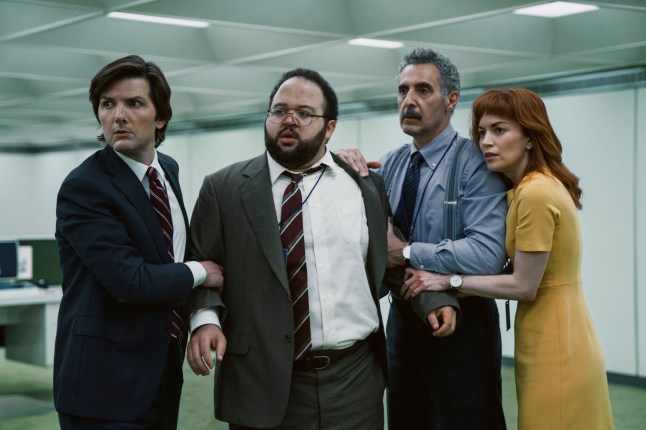 This image released by Apple TV+ shows Adam Scott, from left, Zach Cherry, John Turturro and Brit Lower in a scene from "Severance." (Apple TV+ via AP)
