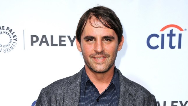 Star Trek and Transformers producer Roberto Orci wearing a suit at a red carpet event