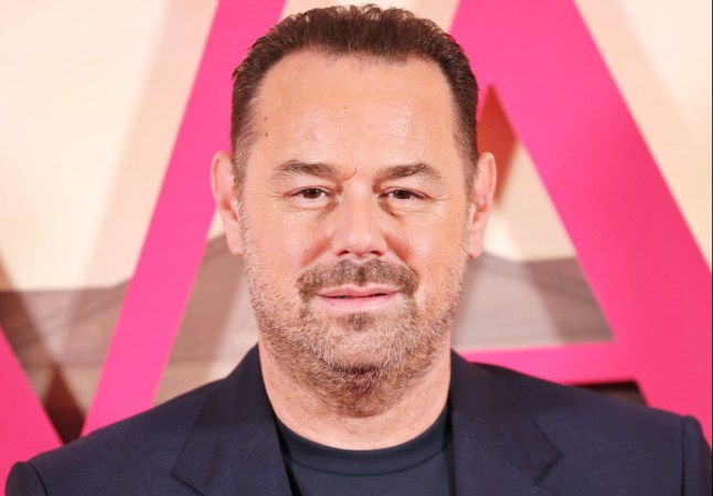 Danny Dyer smiles while posing on the red carpet