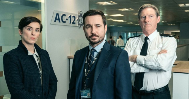 Martin Compston, Vicky McClure and Adrian Dunbar in Line of Duty, all in smart office attire and looking stern.