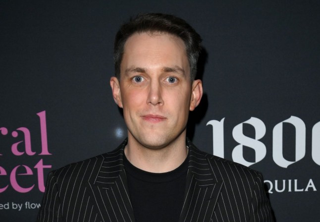 Chris Stark wearing a striped jacket at a Brit Awards after-party