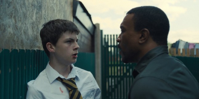 Kaine Davies as Ryan Kowalsky, Ashley Walters as Detective Inspector Bascombe, in Adolescence