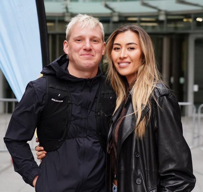 Radio 1 presenter Jamie Laing poses for a photo with his wife Sophie Habboo, outside BBC Broadcasting House in London before his Red Nose Day Run, a 150+ mile run from London to Manchester to raise money for Comic Relief. Picture date: Monday March 17, 2025. PA Photo. See PA story SHOWBIZ ComicRelief. Photo credit should read: Ian West/PA Wire