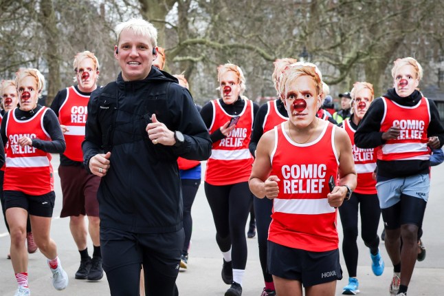 LONDON, ENGLAND - MARCH 17: BBC Radio 1 presenter Jamie Laing with runners wearing Laing masks during the morning of day one on his 2025 Comic Relief challenge in Hyde Park on March 17, 2025 in London, England. Radio 1's "Ultra Marathon Man with Jamie Laing" for Red Nose Day, will see Jamie conquering daily ultra-marathons across a 5-day stretch, seeing the host run more than 150 miles from London to Salford, Manchester. (Photo by Tristan Fewings/Comic Relief/Getty Images)