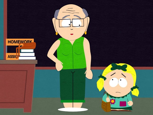 Mr Garrison looking down on Butters as Marjorine in a classroom in South Park