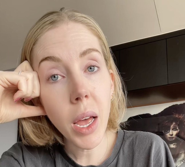 Katherine Ryan resting her head on her hands during a TikTok video