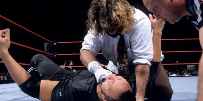 Mankind - AKA Mick Foley - uses Mr Socko on The Rock during an I Quit Match at the WWE Royal Rumble 1999
